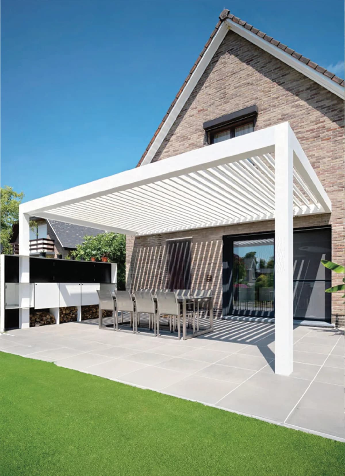 Aluminum louvered pergola providing adjustable shade over a patio
