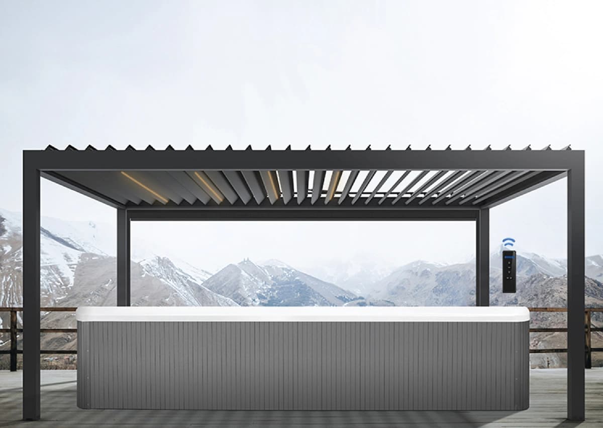 Wide-span pergola covering a stone patio and lounge furniture