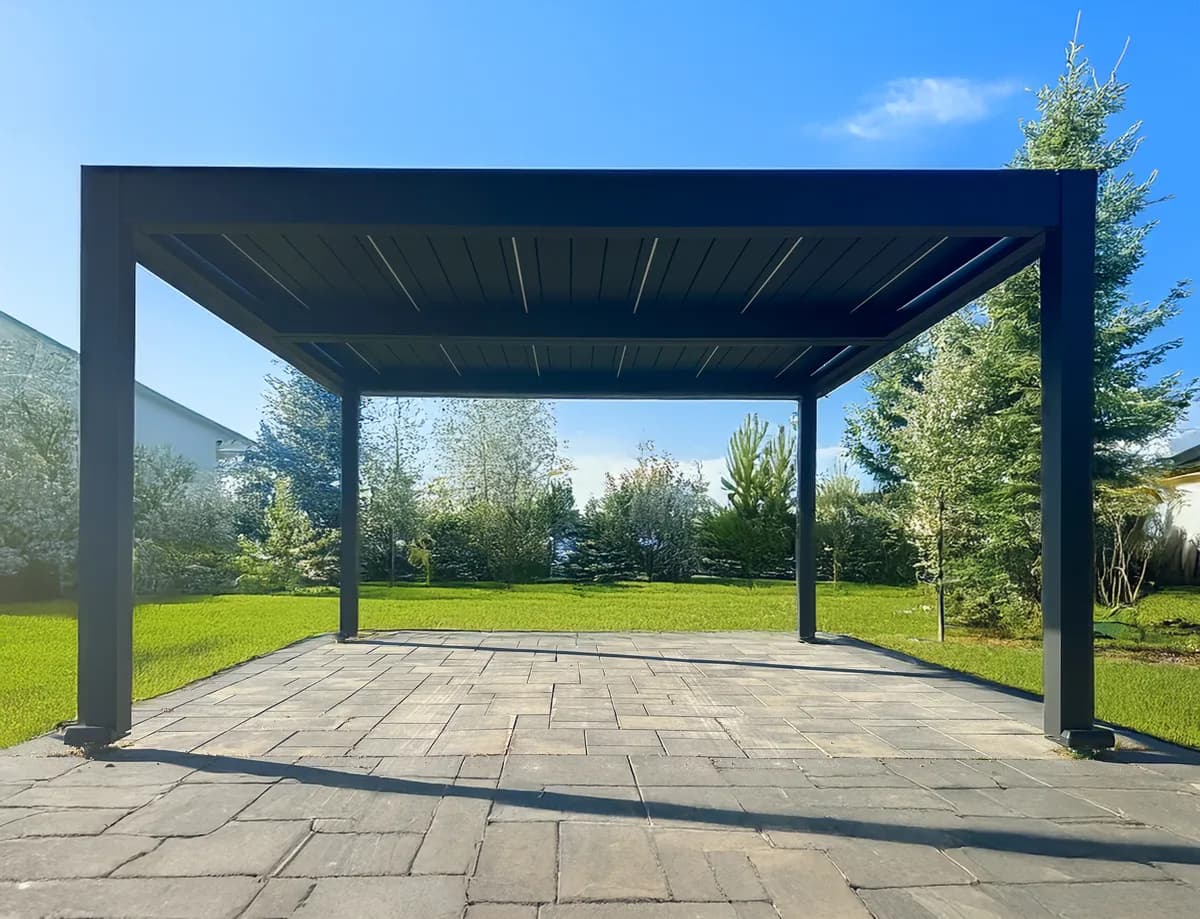 Backyard pergola with sloped roof lines and durable aluminum frame