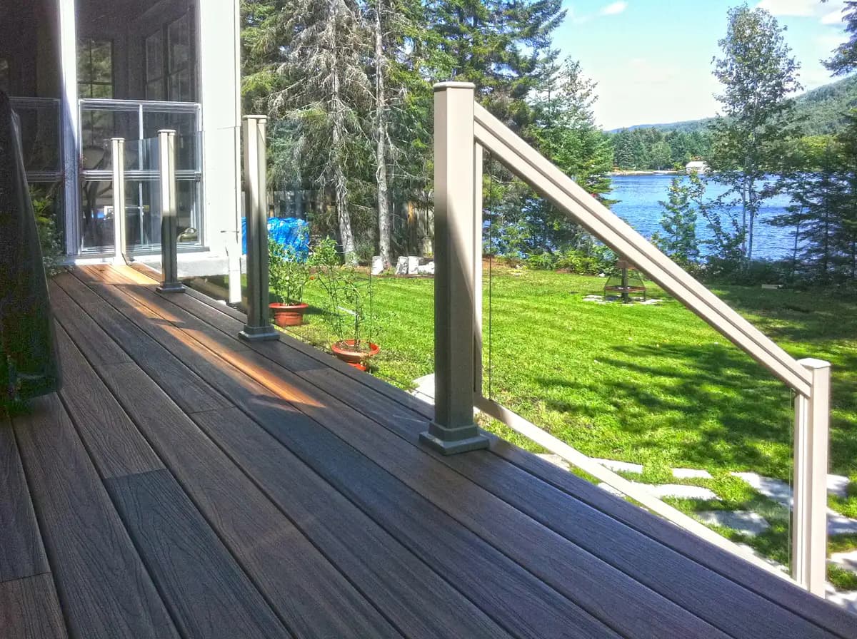 Topless glass deck railing with aluminum posts on a residential deck