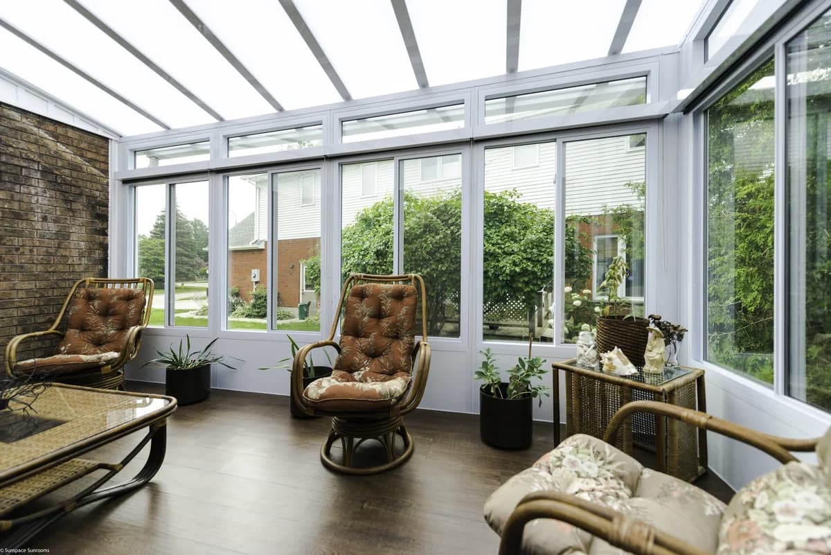Model 300 sunroom exterior with white aluminum framing