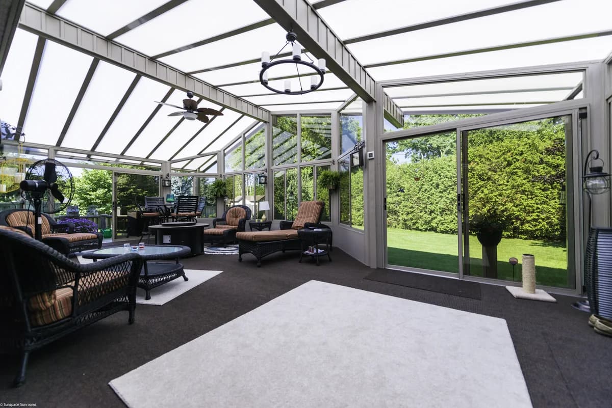 Three-season sunroom corner detail with WeatherMaster-style glazing