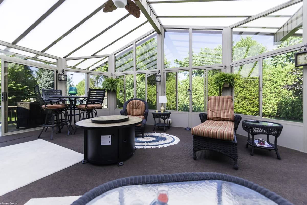 Sunroom addition blending with existing home siding and roofline