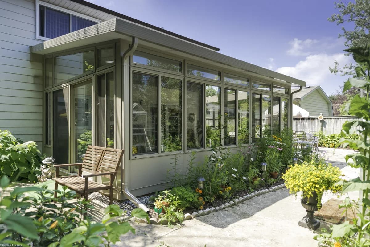Sunspace Model 300 three-season sunroom with large glass walls